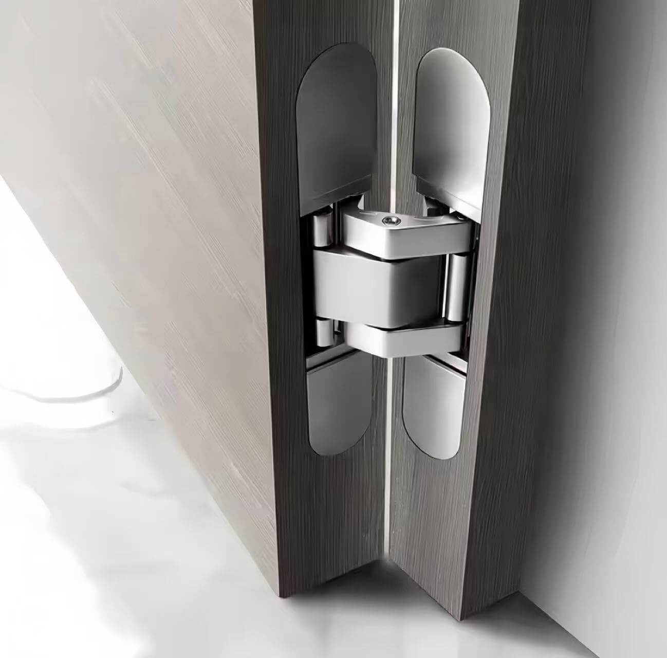 Two-pack hidden door hinges set displayed together